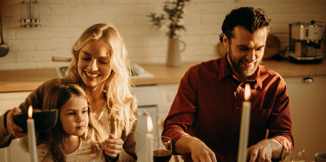 A family having a meal at the table.